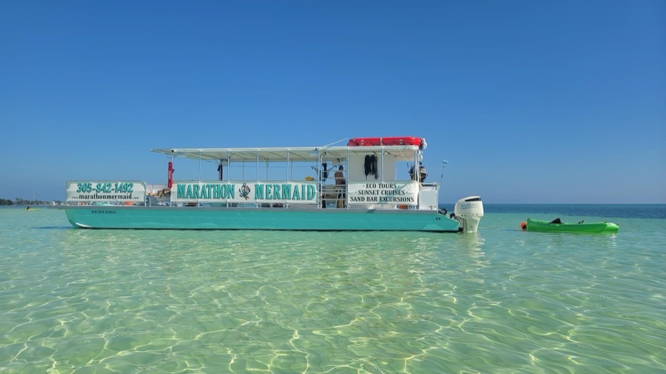 The Marathon Mermaid anchored at a turquoise Keys sandbar