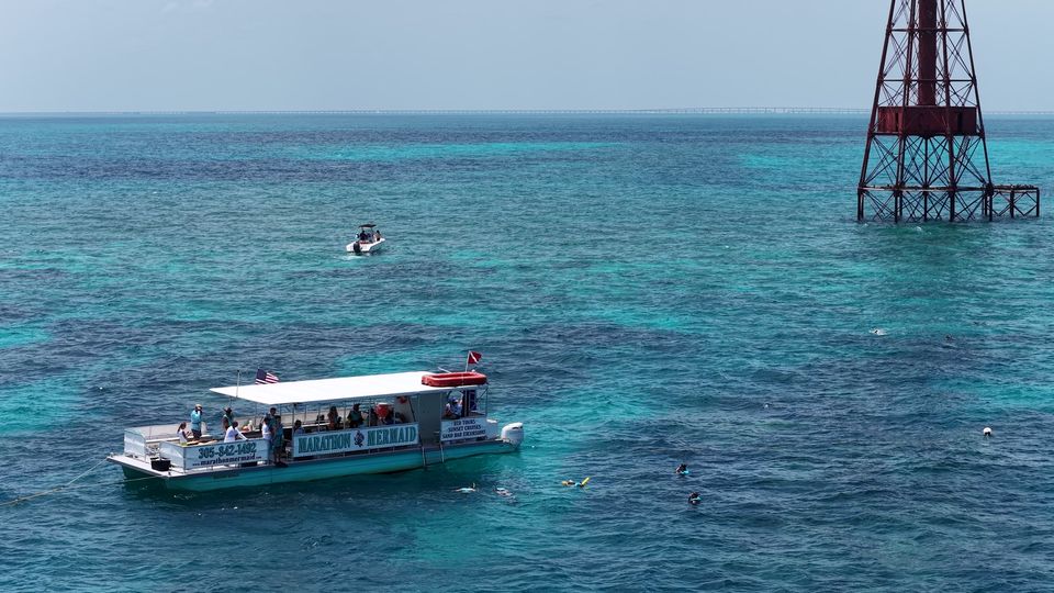 Aerial view of the Marathon Mermaid catamaran over the turquoise waters of the reef