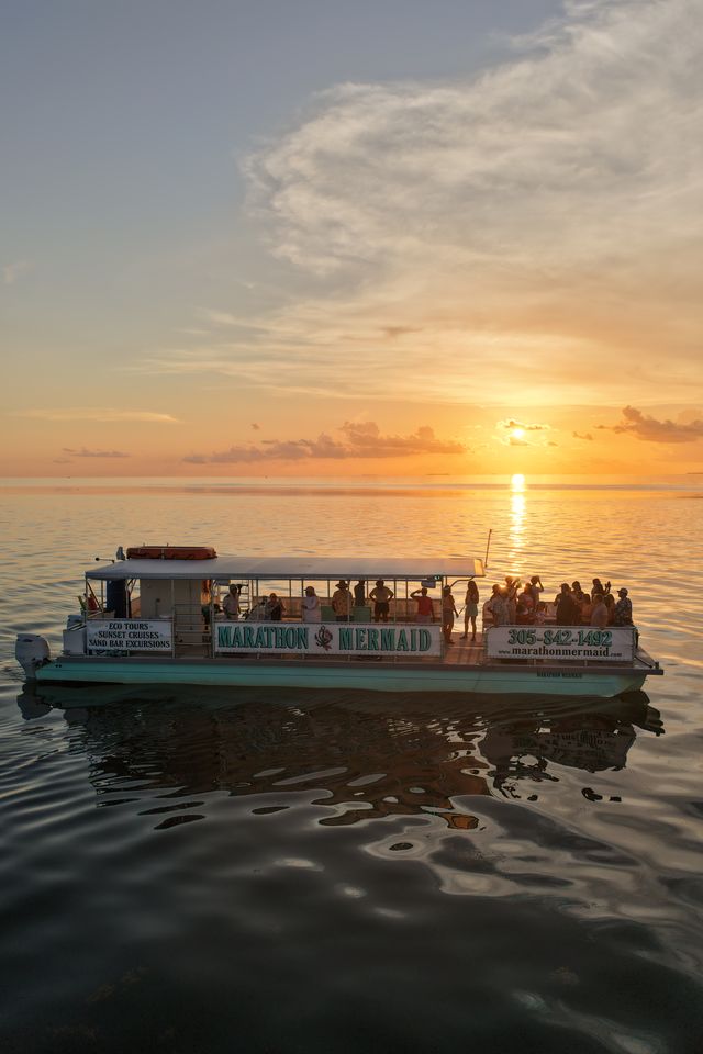 The catamaran glowing against a golden Islamorada sunset