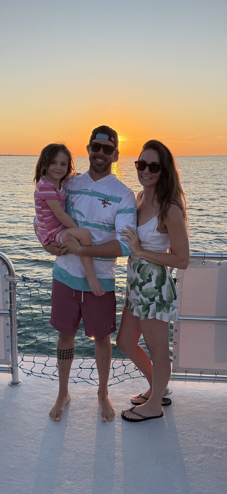 A family together on the Marathon Mermaid at sunset