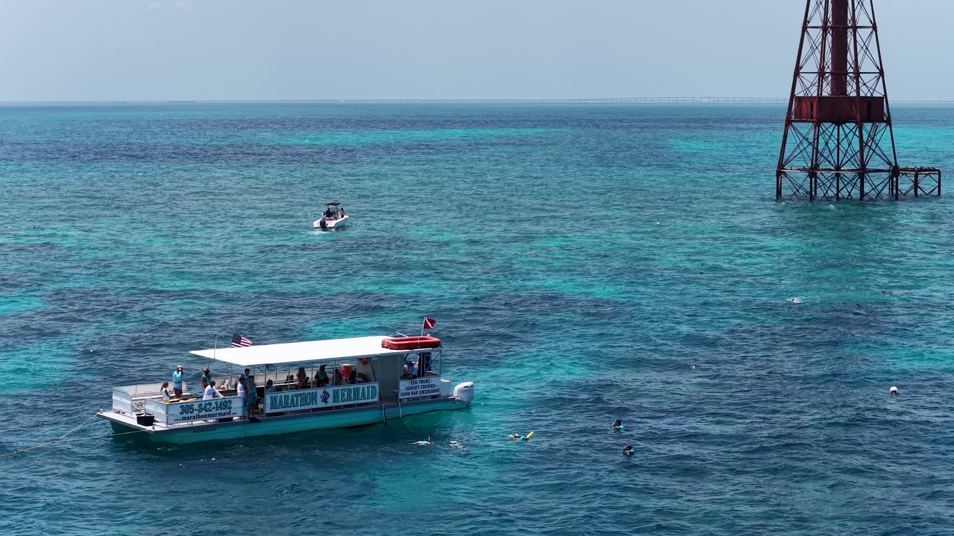 Aerial view of the boat over the turquoise Alligator Reef