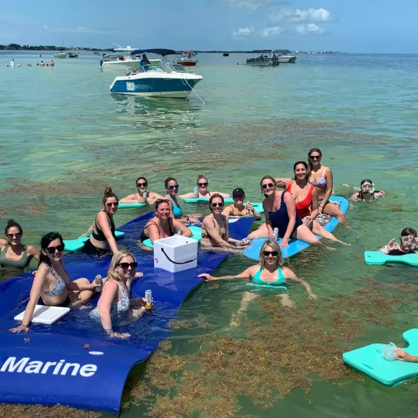 a group of people swimming in a body of water