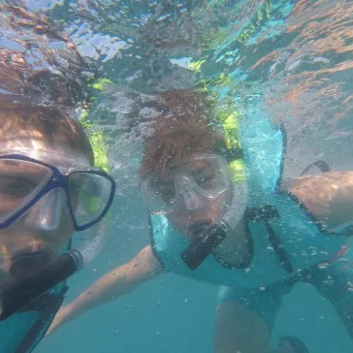 a man swimming in a pool of water