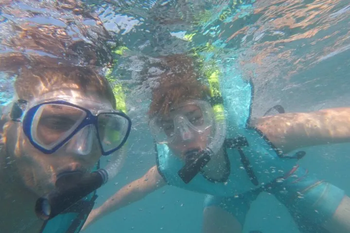 a man swimming in a pool of water