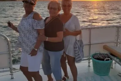 a group of people standing on a beach
