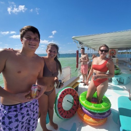 a group of people standing on a beach