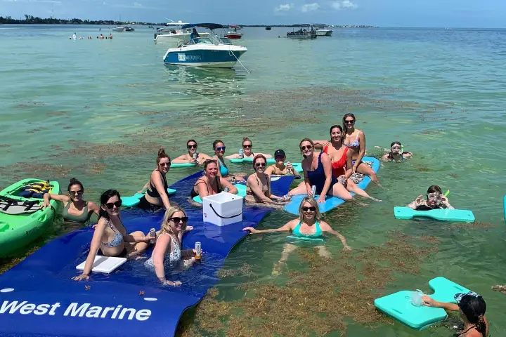 a group of people swimming in a body of water